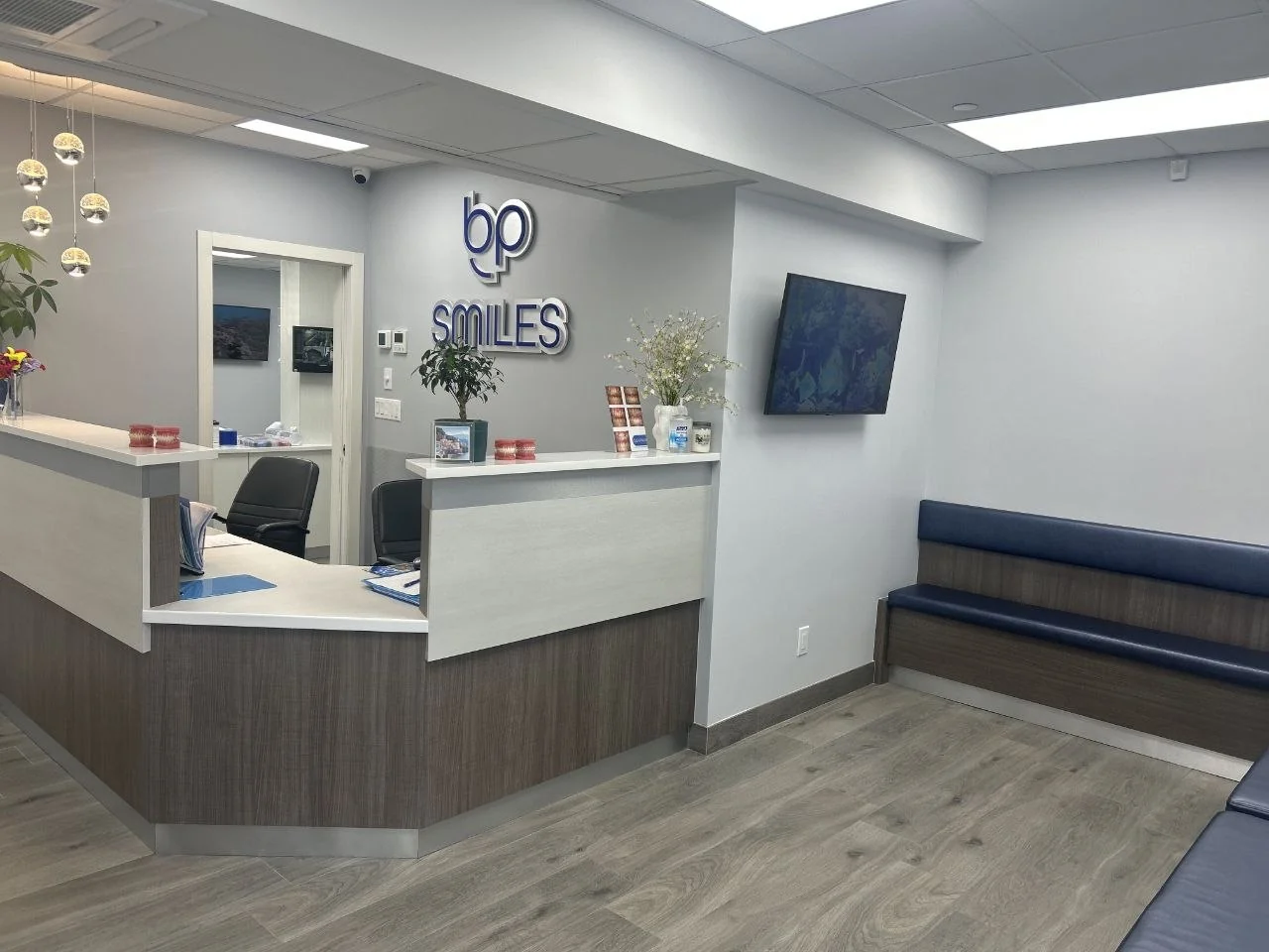 The reception desk and waiting area at BP Smiles Orthodontics in Queens.